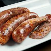 Makanek · Snappy sausages made with beef and Lebanese spices, grilled until crisp.