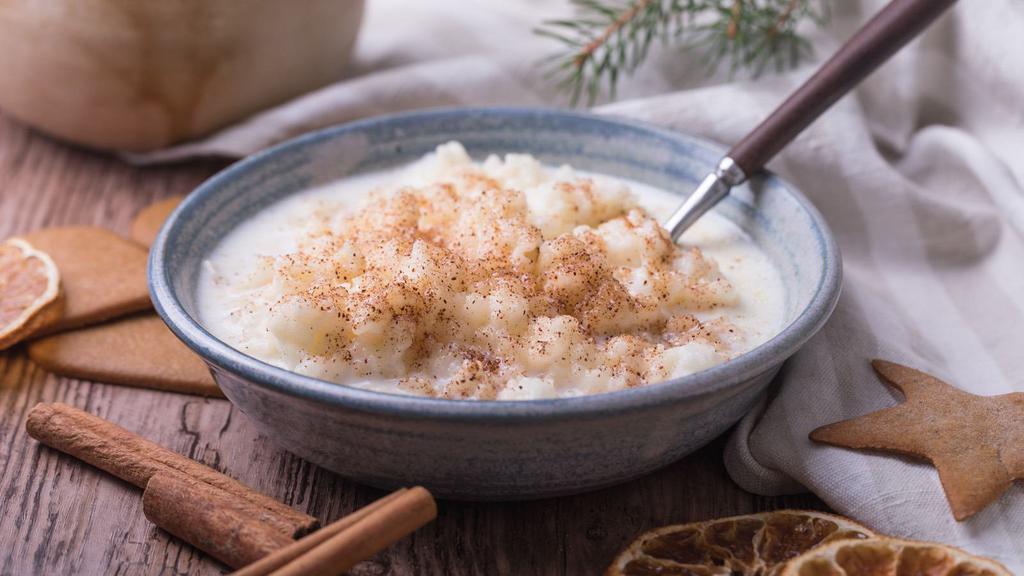 Riz Bi Hale (Rice Pudding) · Classic Lebanese rice pudding drizzled with orange blossom water and sweet syrup. Topped with a dash of cinnamon.