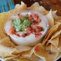 Large Chips And Omg Queso (Queso, Guac, Pico) · A scoop of our homemade guacamole and pico de gallo smothered in our delicious chile con que...