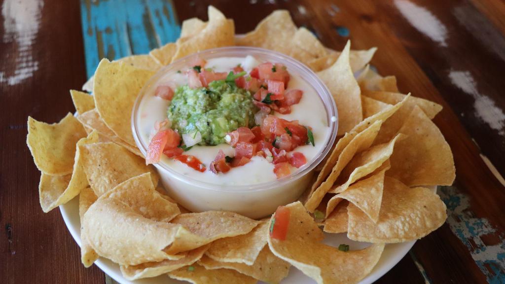 Large Chips And Omg Queso (Queso, Guac, Pico) · A scoop of our homemade guacamole and pico de gallo smothered in our delicious chile con queso. Served with chips.