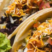 Grass-Fed Skirt Steak Taco Plate · Comes with your choice of rice and beans on the side.