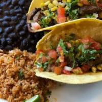 Grass-Fed Braised Beef Taco Plate · Comes with your choice of rice and beans on the side.