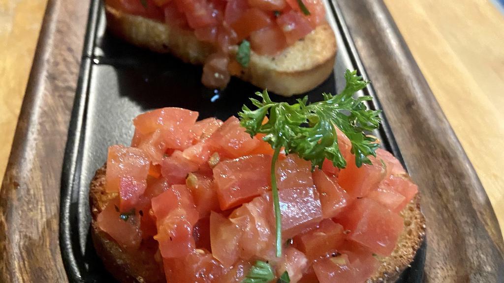 Bruschetta · Tomatoes, basil, garlic & olive oil on grilled pugliese bread.