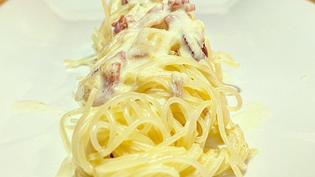 Spaghetti Alla Carbonara · Spaghetti with pancetta, onion, egg and pecorino romano.