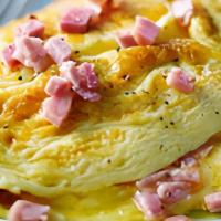The Hammy · Freshly Scrambled Eggs, Lots of Ham and Cheddar Cheese Served Omelet Style!