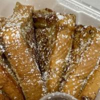 The Classic French Toast · Our thick sliced, hand-dipped favorite, topped with sweet cinnamon sugar and a dusting of po...