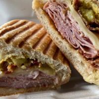 The Cubano · Deluxe ham, crispy bacon, Swiss cheese, sliced pickle, dijon mustard.