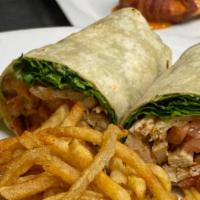 Grilled Chicken Wrap · Sliced grilled chicken, tomato, lettuce, onion, bacon & sun-dried tomato mayonnaise, wrapped...