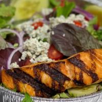 Grilled Atlantic Salmon Salad · Grilled salmon over baby field greens, onions, tomatoes, cucumbers and gorgonzola cheese tos...