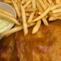 Guinness Fish & Chips · Guinness battered swai filet served with lemon tartar sauce and home cut fries.