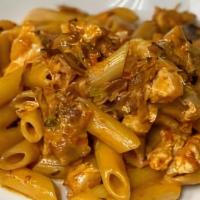 Penne Vodka With Chicken · Sliced sauteed chicken breast, bacon and onion in a vodka tomato cream sauce.
