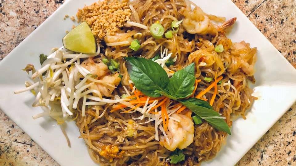 Pad Thai · Stir fried rice noodles with egg, tofu bean sprouts, and scallion in a tamarind sauce topped with crushed peanuts.