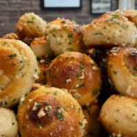 Garlic Knots (6 Or 12 Pieces) · Garlic knots topped with garlic & olive oil or butter, herb seasoning, baked to perfection. ...