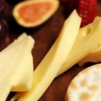 Cured Meats & Cheeses · Chef's choice of assorted dried meats, cheese and fruit served with crackers.