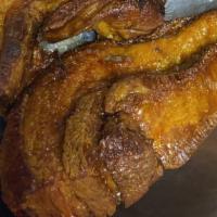 Chicharrones Con Tostones · Fry pork