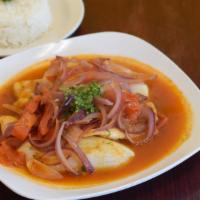 Sudado De Pescado · Steamed fish fillet in a special fish broth served whit rice and potatoes.