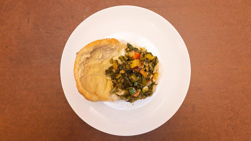 Callaloo & Saltfish · Jamaican vegetable & saltfish seasoned and cooked to a succulent taste, then wrapped in a loaf of Coco-bread.