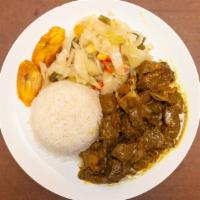 Curry Goat · Goat meat marinated in curry & Caribbean spices.