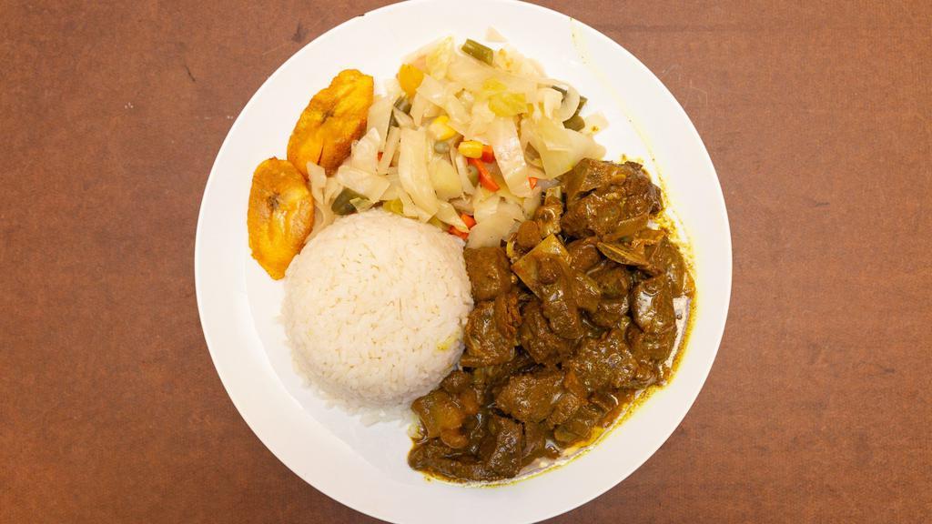 Curry Goat · Goat meat marinated in curry & Caribbean spices.