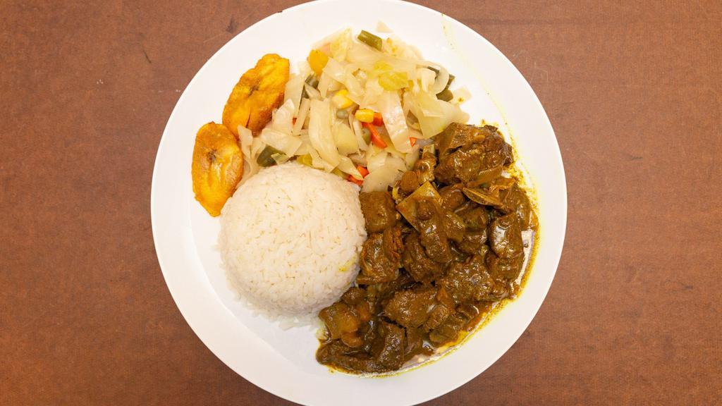 Mini Curry Goat · Serve with your choice of Rice&Peas OR White Rice, Steam veggies and plantain.