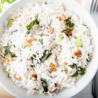 Coconut Rice · Rice fried with freshly grated coconut and seasonings. Served with pickel and pappadam.
