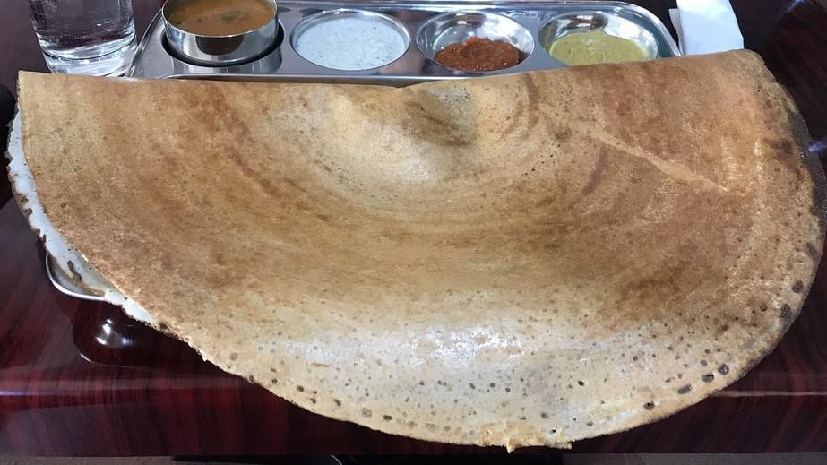Masala Dosa · Light, crispy, sour-dough crepe made from rice lentil with potato filling. Served with sambar and chutney.