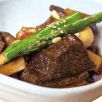 Galbi Jjim · Chef''s choice. Braised marinated prime short ribs in special sweet soy sauce reduction.
