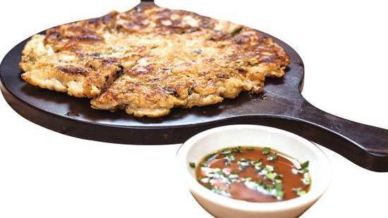 Hae Mool Pa Jun · Scallion pancake with an assortment of fresh seafood.