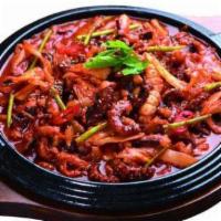 Ojing-Eo Bokum · Stir fried squid with vegetables and noodle in a house special gochujang sauce. Comes with a...