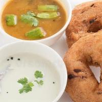 Medu Vada · Crispy savory lentil doughnuts served with sambar and coconut chutney.