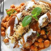 Aloo Tikki Chaat · Hot and crispy served with some of the most delicious toppings such as tamarind chutney, gre...