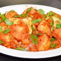 Masala Idli · Chopped idlis sautéed with mustard seeds, curry leaves and a touch of spices, served with sa...