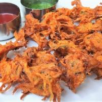 Onion Bhajia · Onion Bhajia is deep fried onion fritters made with gram flour, onion and spices served with...