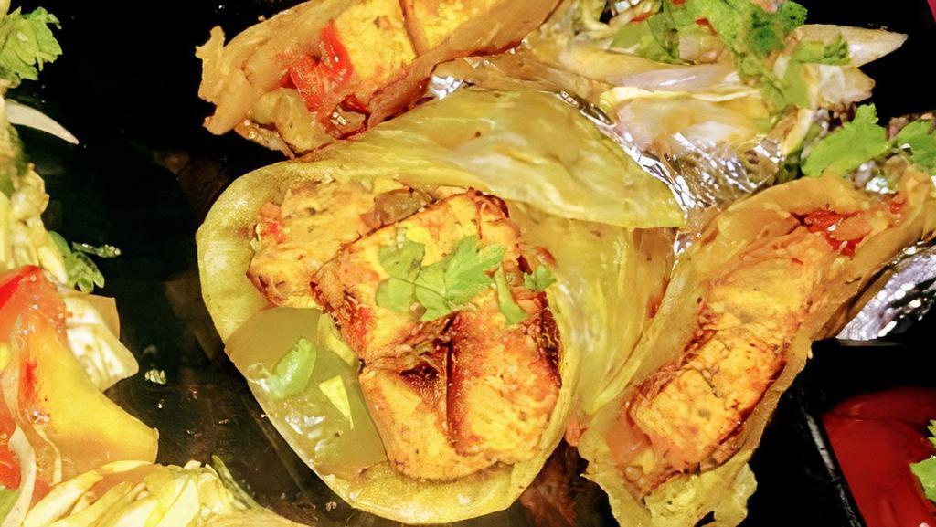Paneer Tikka Kathi Roll · Seasoned paneer rolled in thin paratha with lettuce, tomato, red onions with mint sauce.