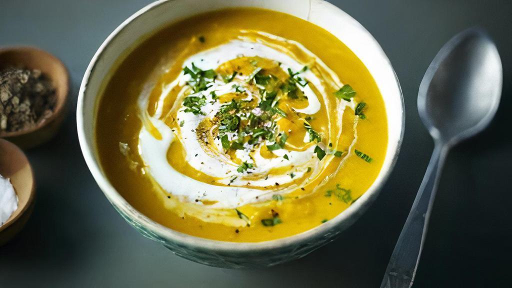 Mulligatawny Soup · Puréed lentils flavored with fresh herbs, delicate spices, cilantro, grated fresh coconut, garnished with juliennes of ginger and carrots.
