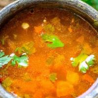 Rasam · Tangy spicy tomato soup with tamarind and spices.