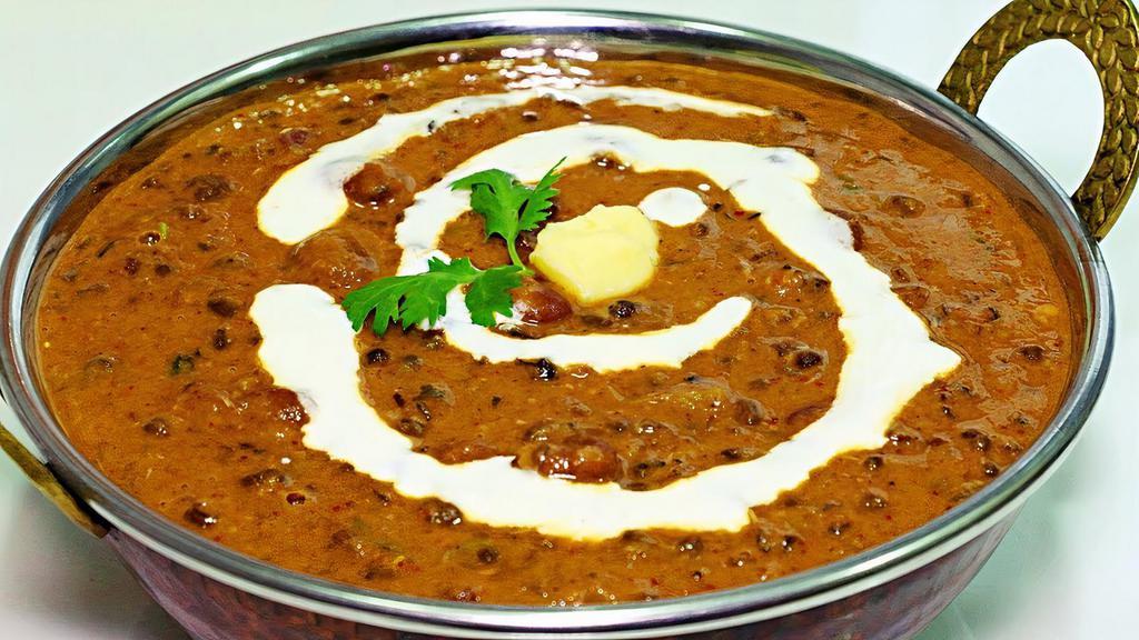 Dal Makhani · Whole black lentils with red kidney beans cooked in a rich buttery sauce.