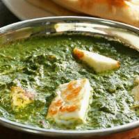 Palak Paneer · Cubes of homemade cottage cheese cooked with Spinach in a tomato based gravy, finished with ...