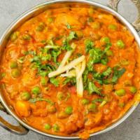 Mutter Mushroom · Fresh mushrooms and green peas in a delicious gravy. Jain option available.