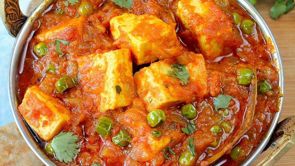 Mutter Paneer · Cubes of fresh cheese with green peas in onion, garlic, ginger and tomato gravy.