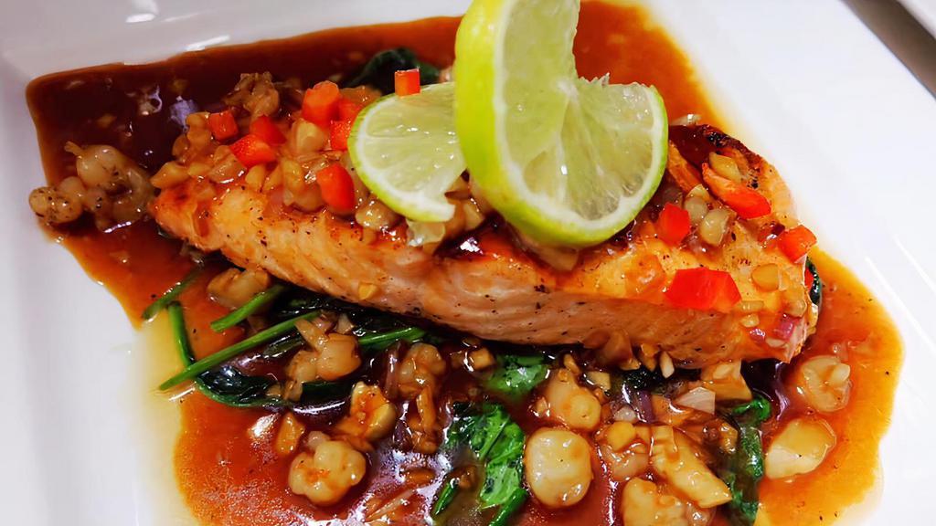 Salmon In The Sea · Served with minced shrimp, scallops, shallots, and garlic. Served with sautéed spinach.