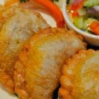 Curry Puff · Fried puff pastry stuffed with chicken, sweet potatoes, carrots, onion, and yellow curry pow...