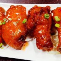 Thai Chicken Wing · Fried, marinated chicken wing with honey sweet chili sauce.