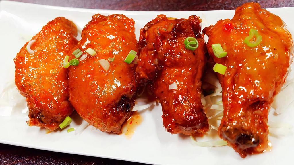 Thai Chicken Wing · Fried, marinated chicken wing with honey sweet chili sauce.