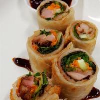 Duck Roll · Crispy duck,spring mix,cucumber and carrots wrapped with Indian's flatbread served with Hoi ...