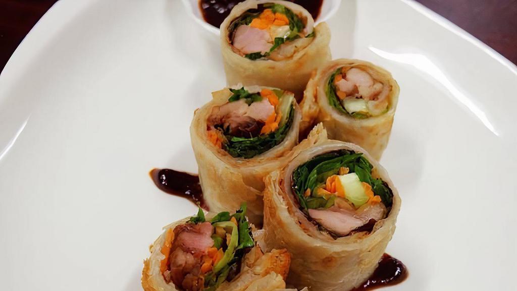 Duck Roll · Crispy duck,spring mix,cucumber and carrots wrapped with Indian's flatbread served with Hoi Sin sauce.