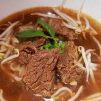 Beef Stew Noodle Soup · Beef stew, rice noodles, Chinese broccoli, bean sprouts, green onion, cilantro, and fried ga...
