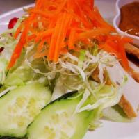 Thai Salad · Iceberg lettuce, tomatoes, cucumber, red onion, and bean curd. Served with peanut dressing.