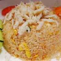 Crabmeat Fried Rice · Thai style fried rice with fresh crab meat, eggs, garlic, peas, and carrots.