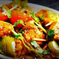 Chicken Achari · Boneless chicken cooked with mango pickle, herbs and fresh spices.
